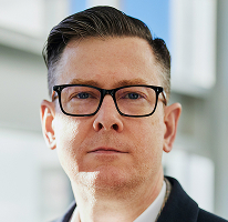 Alexander Hughes, PDG et responsable d'une entreprise de cryptomonnaies, portrait